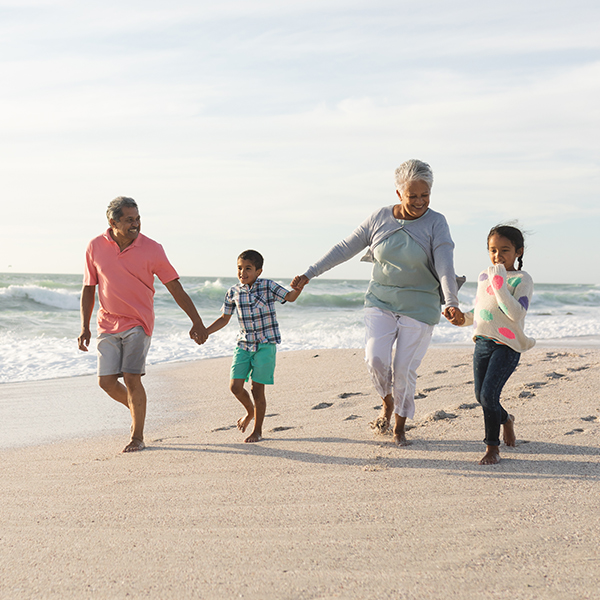 multi generation family walking holding hands on beach will you have enough to retire retirement faragi group delaware