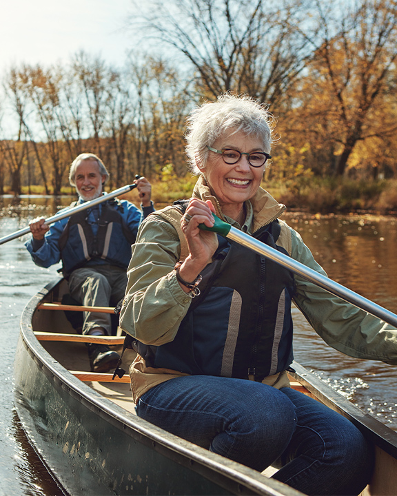 retired couple kayaking on lake guaranteed income annuity faragi group delaware