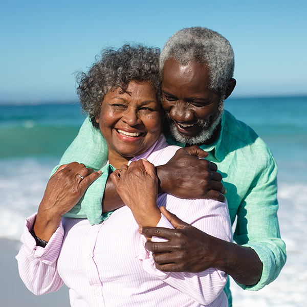 retired senior couple embracing on beach will you have enough to retire retirement faragi group delaware