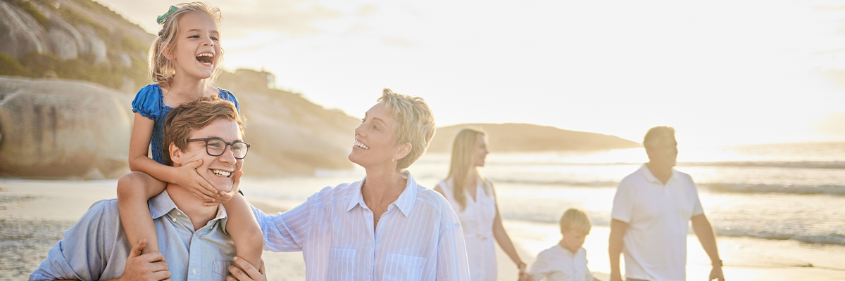 smiling family spending time walking beach annuity benefits annuities faragi group delaware